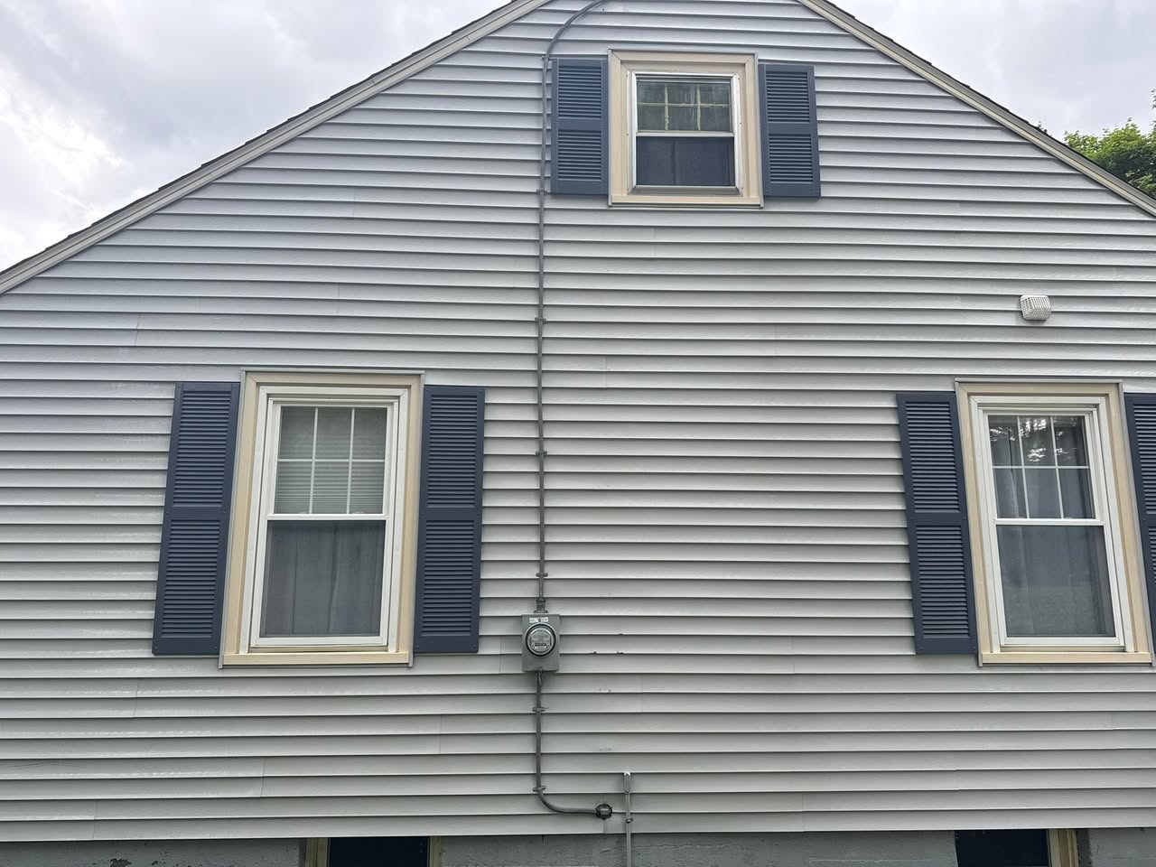 Clean house siding following a Wicked Good Washers exterior cleaning project