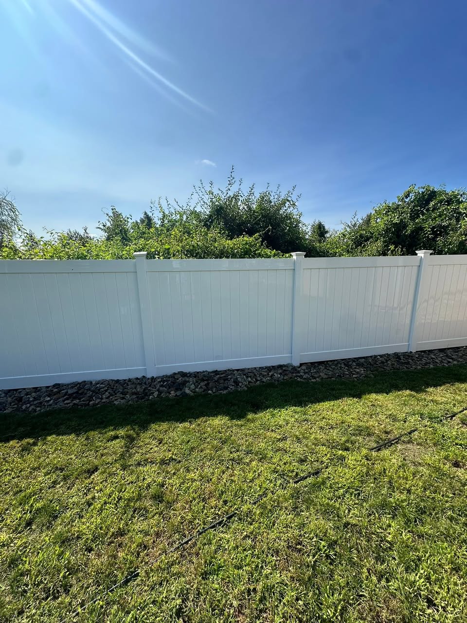 Clean white vinyl fence